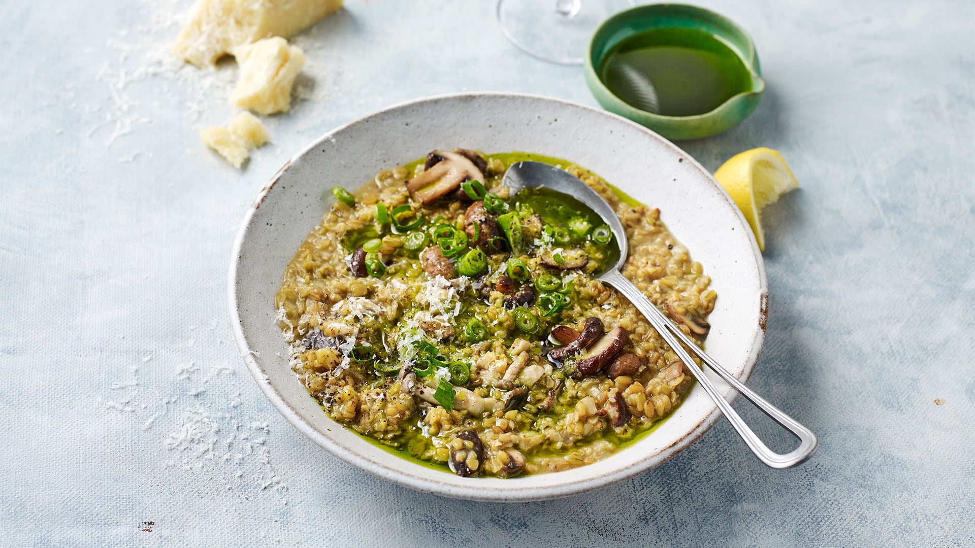 Mushroom freekeh risotto with spring onion oil
