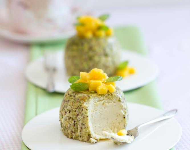 Steamed pistachio cheesecakes with mango