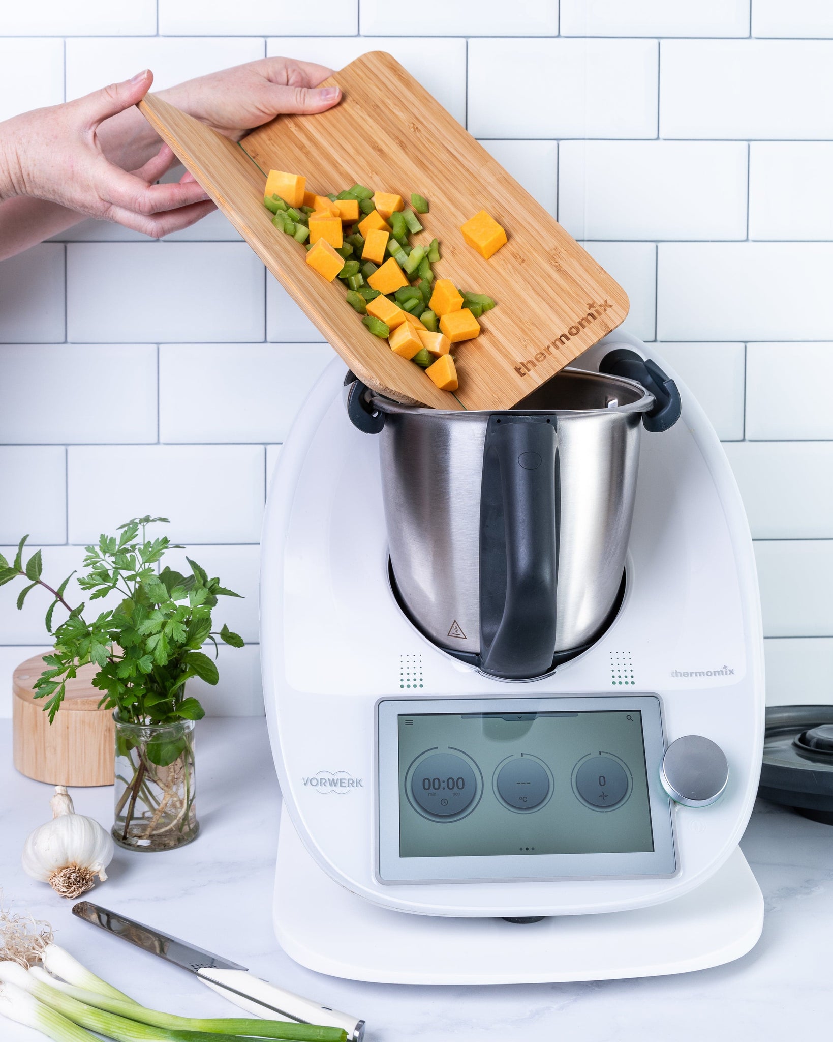 Thermomix® Bamboo Folding Chopping Board above Thermomix